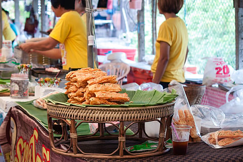 Serving crispy snacks at Bang Nam Pheung Floating Market 