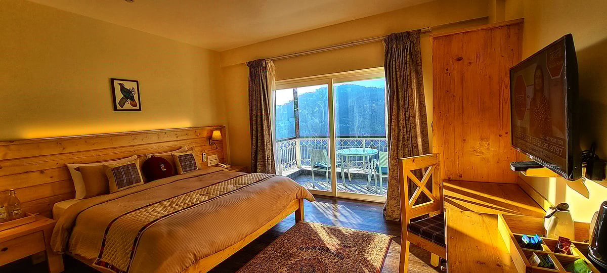 The plush furnishings and wooden structure lend an element of serenity to the rooms