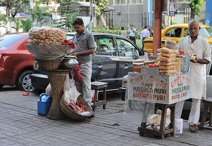 A phuchka seller and bhelpuri stall