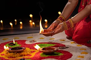 Shutterstock : Traditional diyas are lit during diwali celebrations