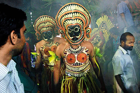 A Padayani artist at the Padayani festival celebrated in Kadammanitta Temple, Kerala