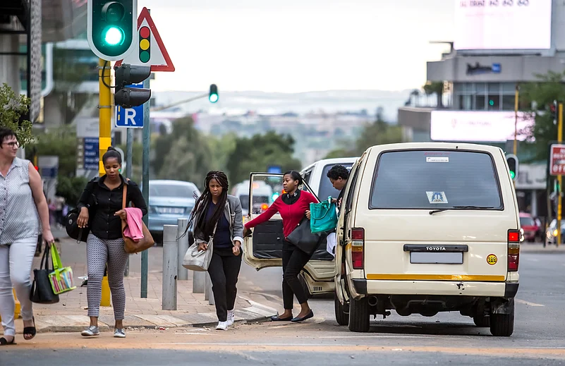 People getting out of a taxi in Johannesburg