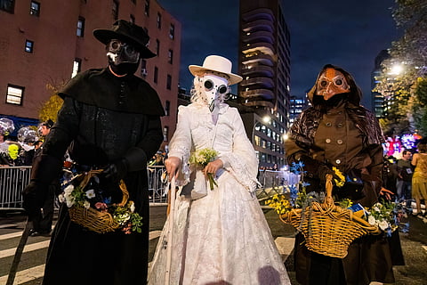 People wearing scary costumes at NYC Village Halloween parade