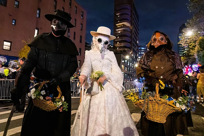 People wearing scary costumes at NYC Village Halloween parade