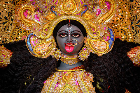 Idol of Goddess Maa Kali at a decorated puja pandal in Kolkata