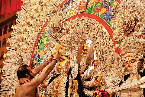 Banerjee performing a pujo ritual