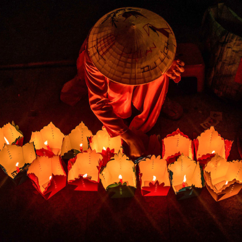 On Wandering Souls Day paper money and clothes are burnt for the spirits' use in the afterlife