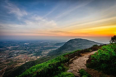 Shutterstock : Beautiful view of Nandi hills during sunset