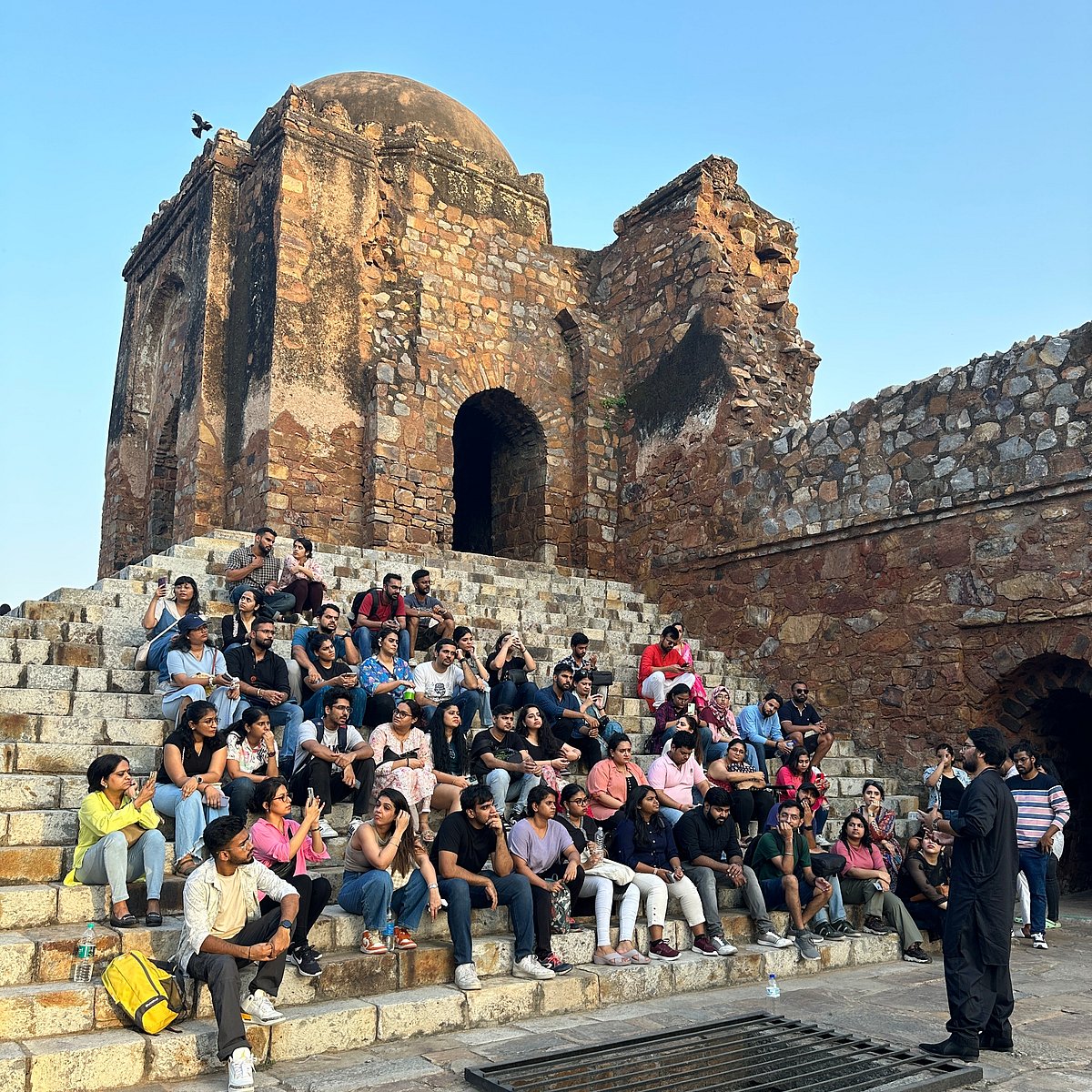 Khan giving a tour of Feroz Shah Kotla Complex