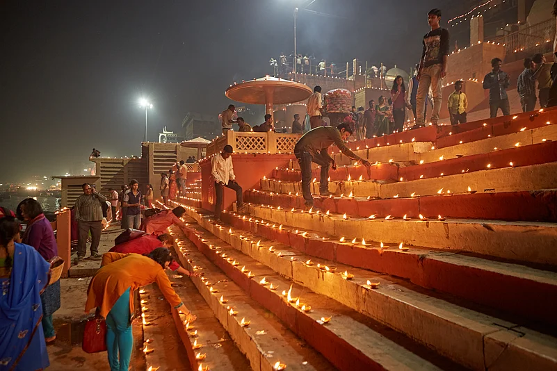 Varanasi Ghats being lit up by diyas