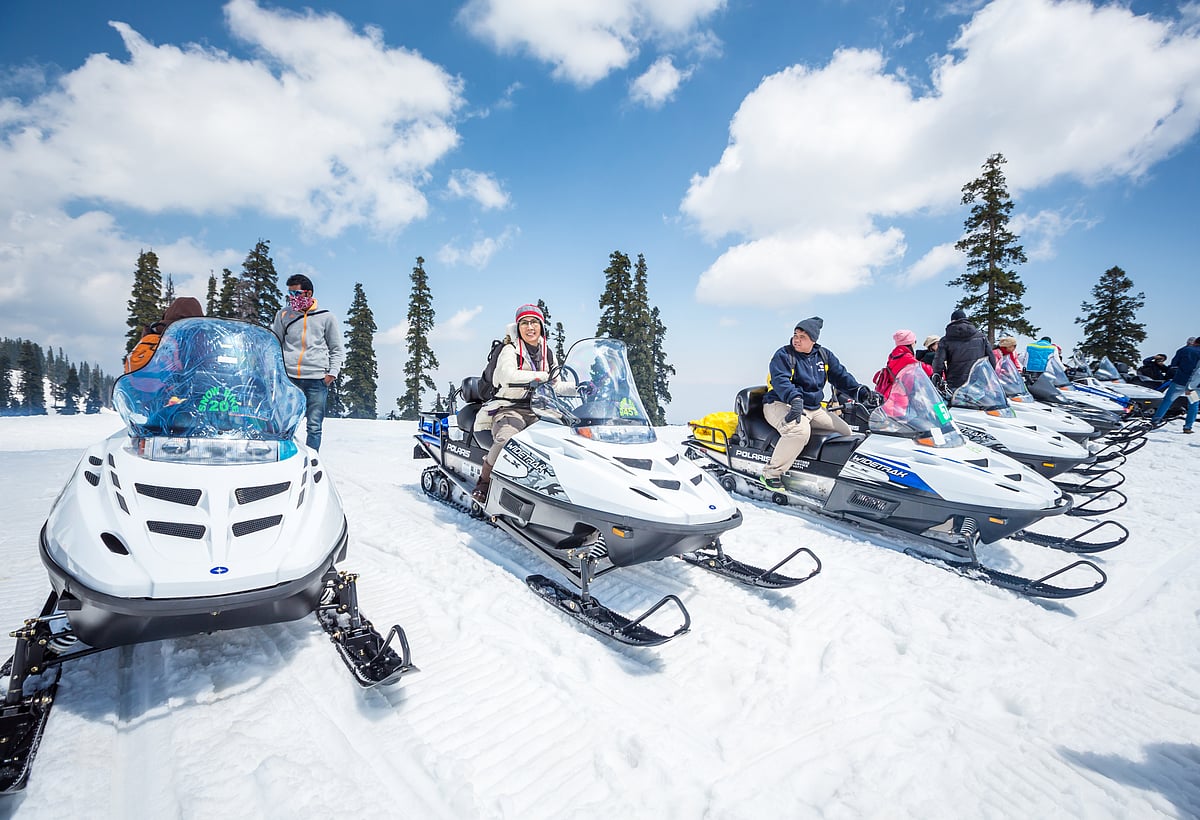 People enjoying snow-bike ride in Gulmarg