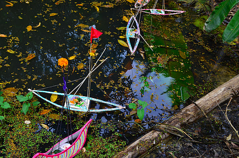 Bali Jatra boats in a pond