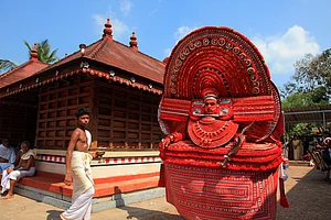 AJP/Shutterstock : A theyyam artist performs at Kadannappalli Muchilot Bhagavati temple in Kannur