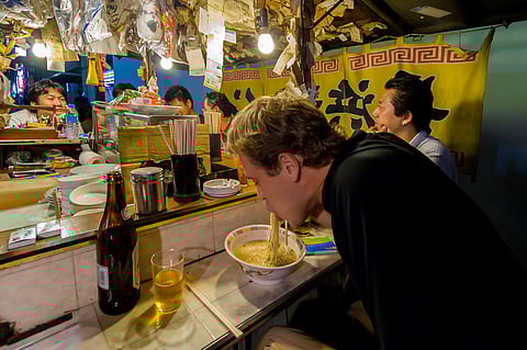 Tourist eating at a Yatai 