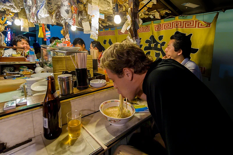 Tourist eating at a Yatai