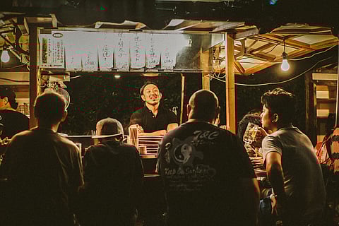 A Yatai owner entertaining customers