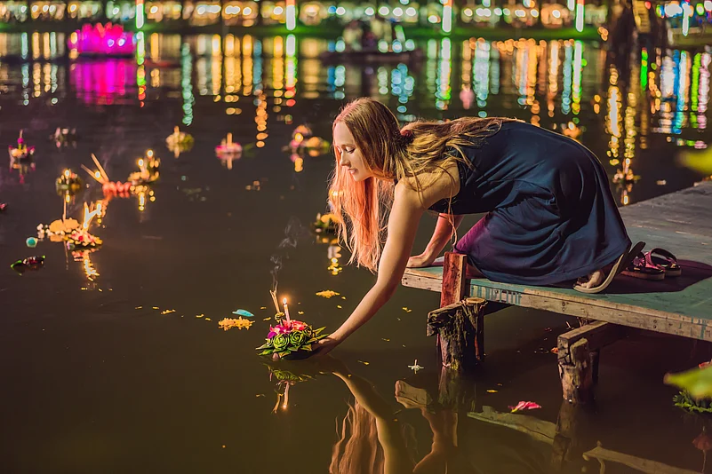 A tourist floating a Krathong