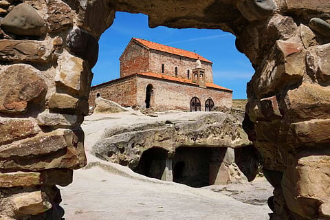A view of the basilica through a passageway at the ancient Uplistsikhe cave town