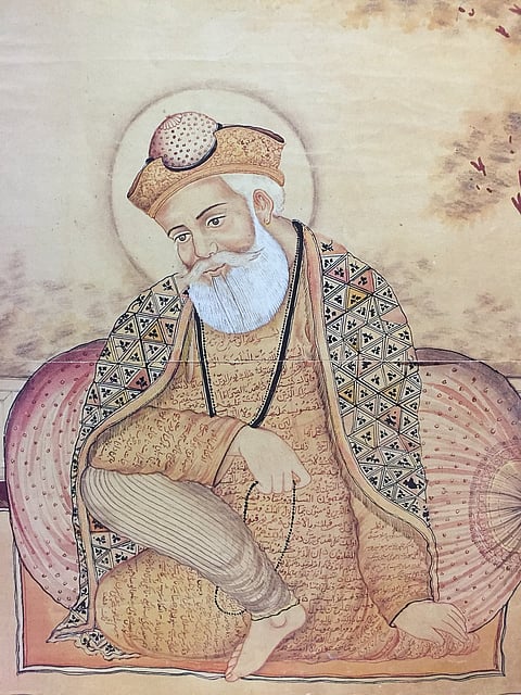 Guru Nanak wearing robe with Perso-Arabic inscriptions containing verses from the Islamic Quraan and Sikh Japji Sahib.