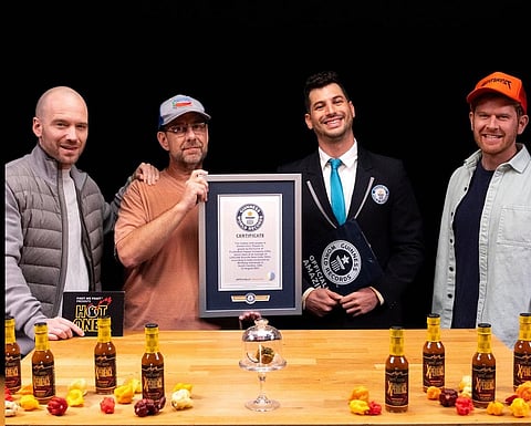 Creator Ed Curie holding the certificate