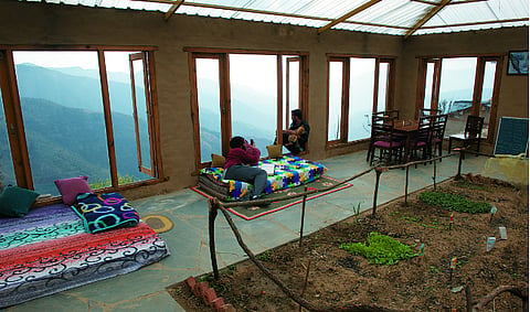At the Goat Village in Uttarakhand, the buildings are built using local materials. Most parts of the properties do not have electricity. In the evenings, the common areas and kitchens are lit by solar lamps. So, the large windows ensure there's plenty of natural light during the day.