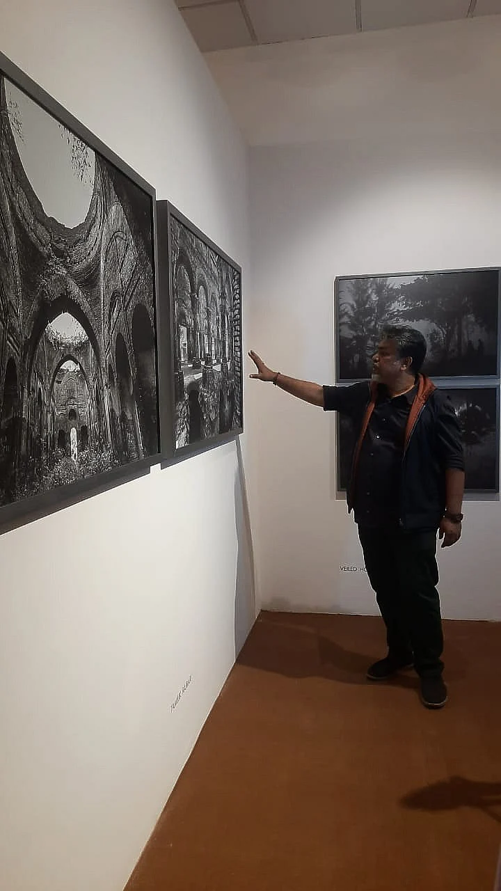 Das discussing the ideas behind a picture during the exhibition walk