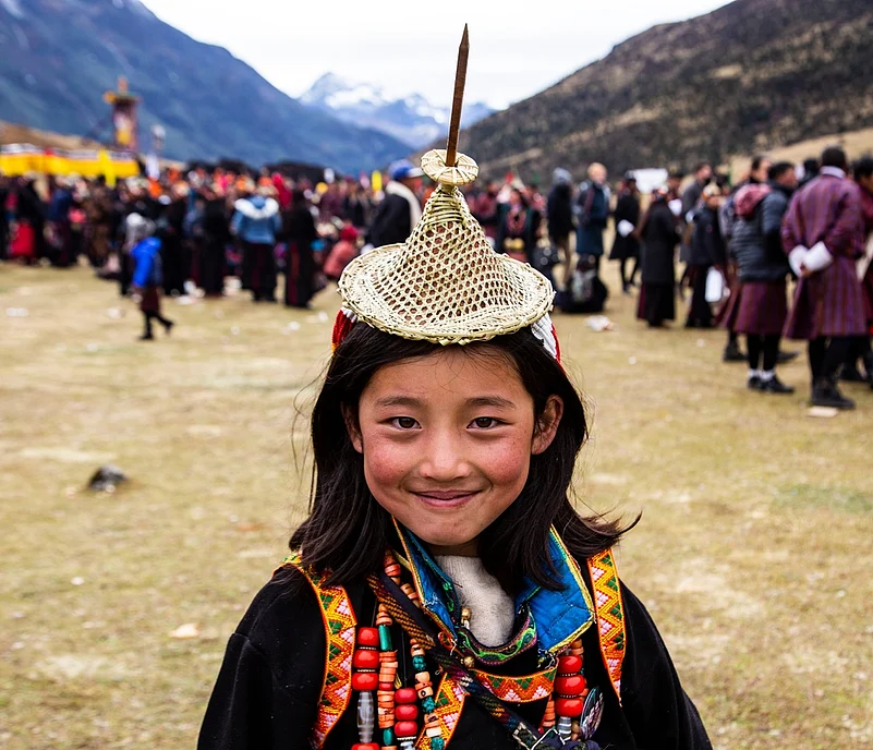 A child in traditional attire at the festival