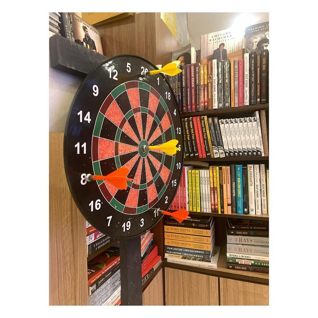 Play a game of darts at the store while browsing