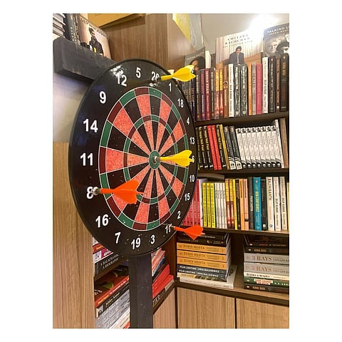 Play a game of darts at the store while browsing