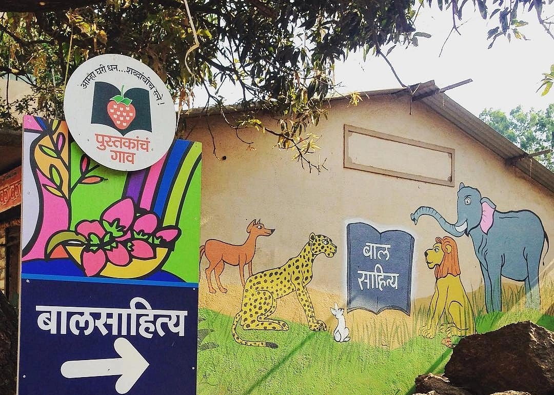 The walls in Bhilar are painted with colourful book characters