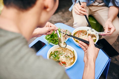 People eating pho