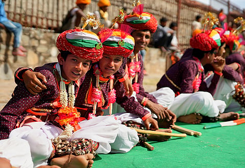 Children in in traditional costumes wait their turn to dance at the Kumbhalgarh festival