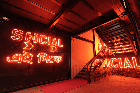 The neon red signage at the entrance