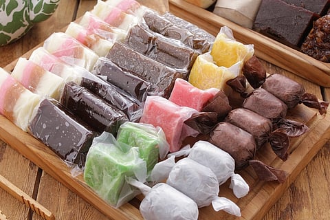 Dodol is a snack made from sticky rice flour, coconut milk, and brown sugar