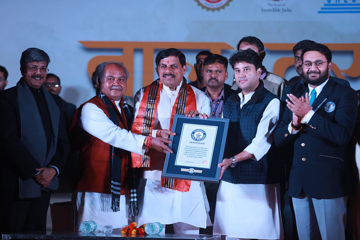 MP CM Mohan Yadav (in centre) with Union Minister Jyotiraditya Scindia (on right) and others, receiving the Guinness World Records certificate