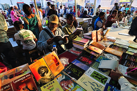 People browse books at the Boi Mela