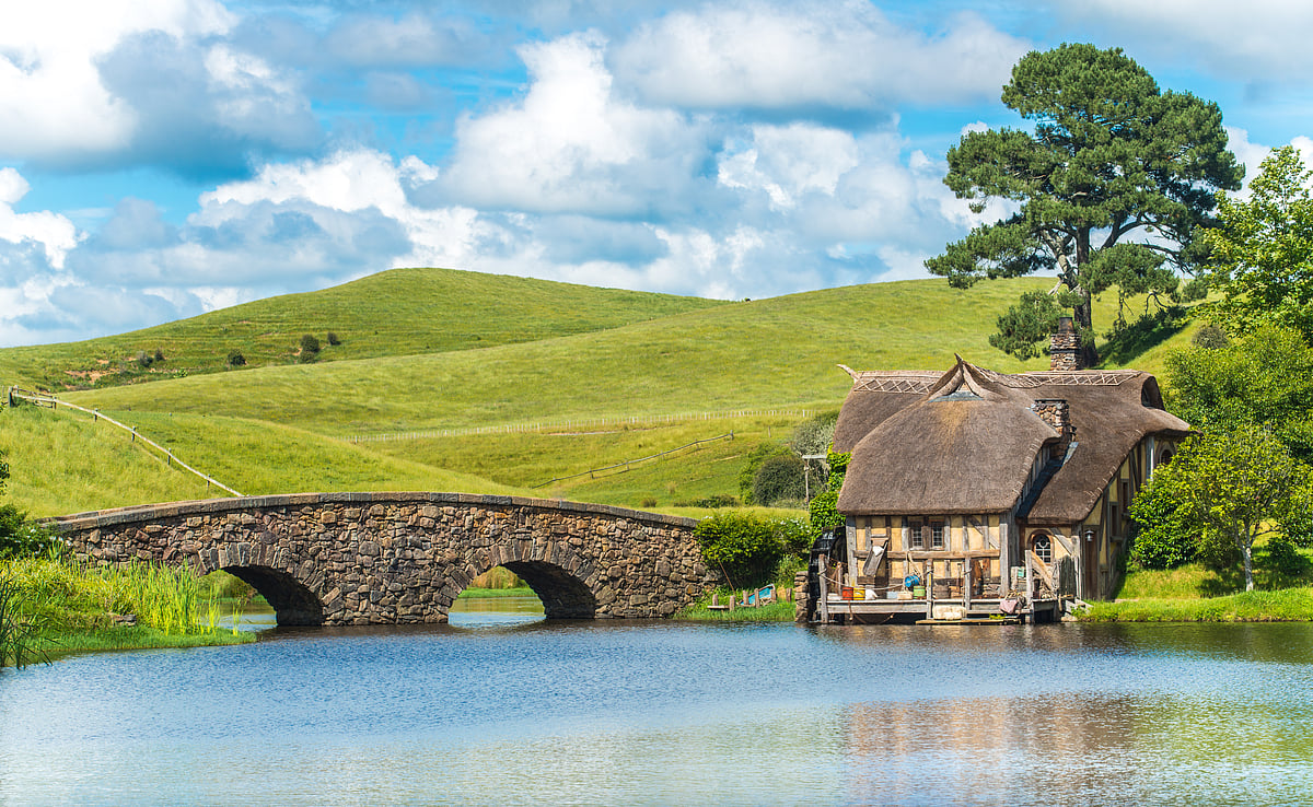 The watermill and bridge are located at the Hobbiton Movie Set in Matamata, New Zealand