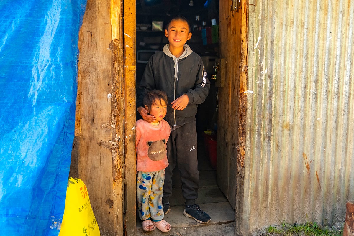 The son and daughter of a Laya basecamp canteen welcoming us at the door. This would be the last stop to get supplies and essentials before heading to the half-day hike to Laya, and the five-days hike to Lunana.