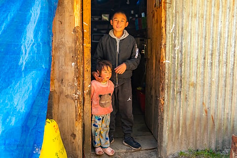 The son and daughter of a Laya basecamp canteen welcoming us at the door. This would be the last stop to get supplies and essentials before heading to the half-day hike to Laya, and the five-days hike to Lunana.