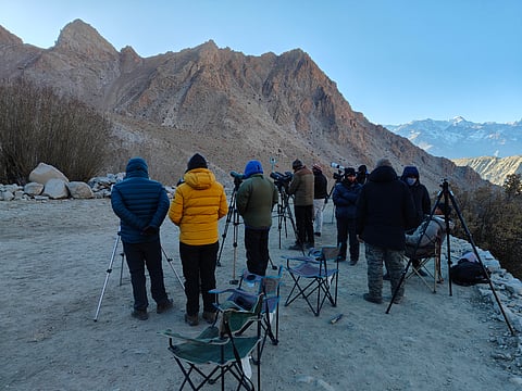 Spotters start locating the snow leopard from the crack of the dawn