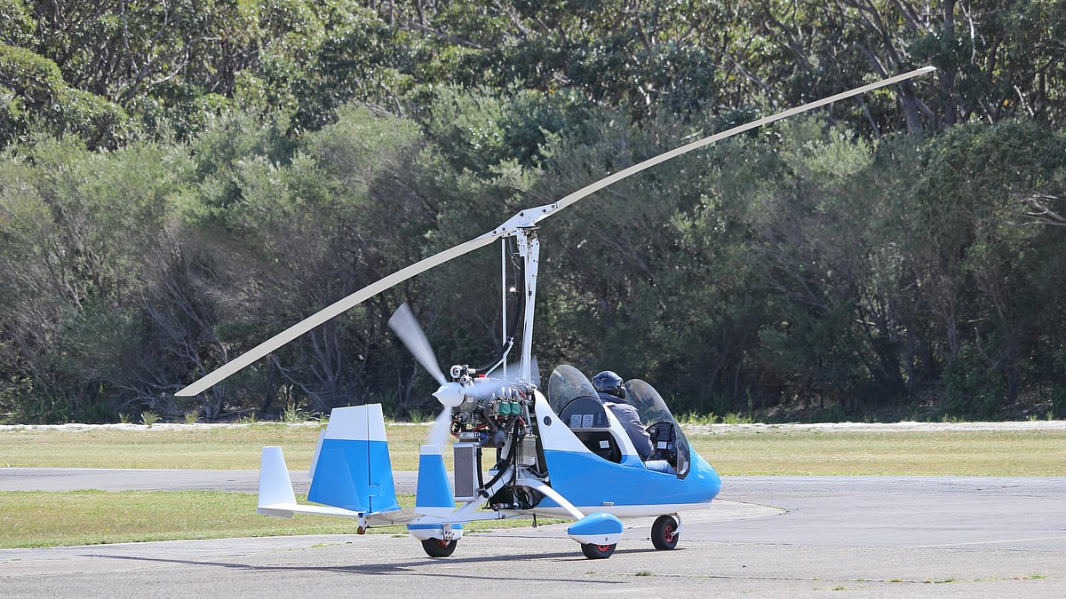 Small blue gyrocopter ready to take off
