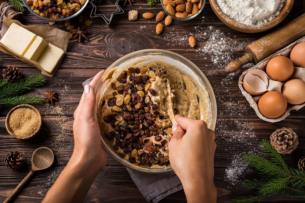 Mixing ingredients for a Christmas fruit cake