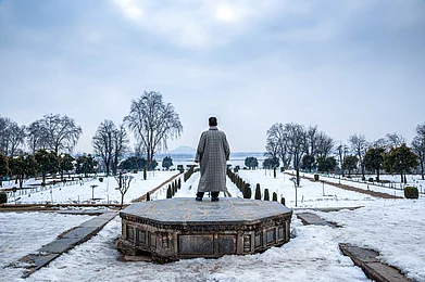ImagesofIndia/Shutterstock : The snow-covered Nishat Bagh Mughal garden during winter in Srinagar, Kashmir