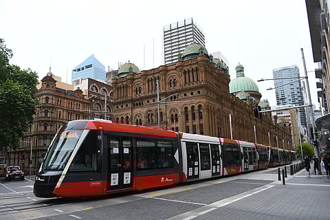 Light train passing Sydney CBD by famous Victoria hall in Gorge St