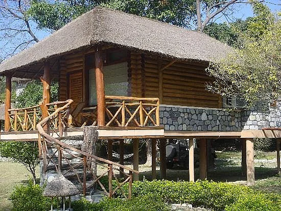 The six plush log huts all overlook the Kosi river