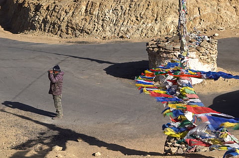 Norbu scanning the mountains