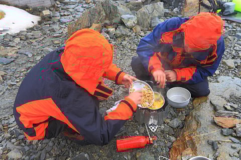 A group of mountaineers cooking