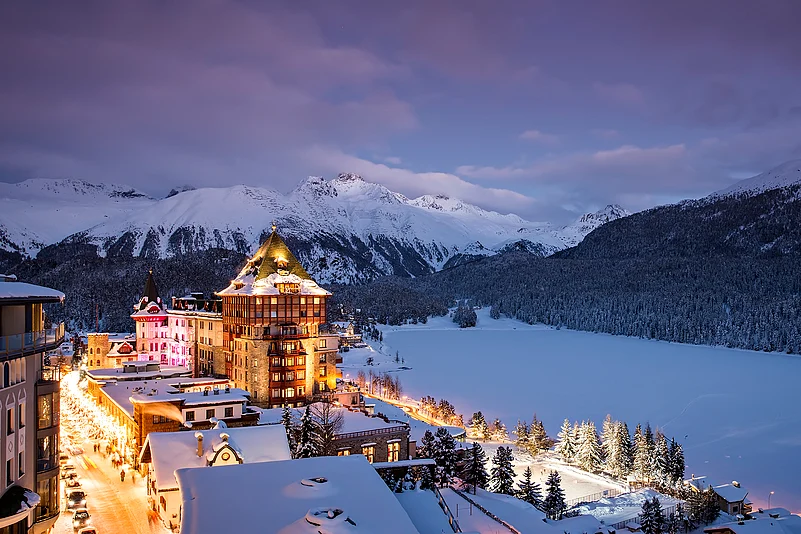 Badrutt’s Palace Hotel is a majestic structure near the snow-covered Alps