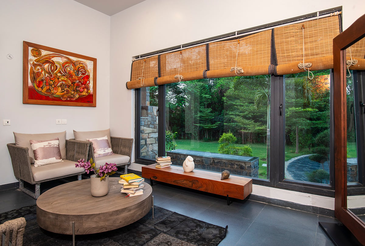 The airy sitting room is the perfect corner to curl up with a book and relax