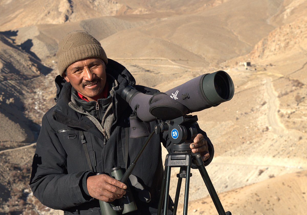 Norbu pausing for a quick shot while loo 
 kin g for the snow leopard